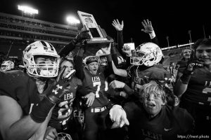 (Trent Nelson  |  The Salt Lake Tribune) Lehi players celebrate the win over Timpview in the 5A high school football championship game at Rice-Eccles Stadium in Salt Lake City on Friday, Nov. 18, 2022.