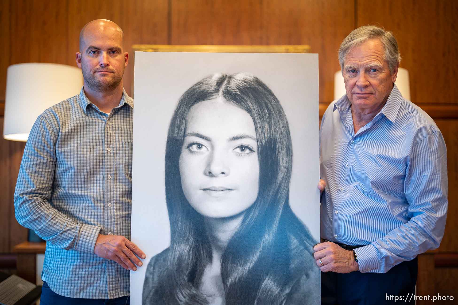 (Trent Nelson  |  The Salt Lake Tribune) Ryan and John Miller with a portrait of Valarie Clark Miller in Salt Lake City on Thursday, Dec. 1, 2022. Valarie is John's late wife, and Ryan's mother.