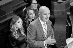 (Trent Nelson  |  The Salt Lake Tribune) Gov. Spencer Cox delivers his State of the State address at the Capitol building in Salt Lake City on Thursday, Jan. 19, 2023. At rear are EmmaKate and Abby Cox, and Lt. Gov. Deidre Henderson.