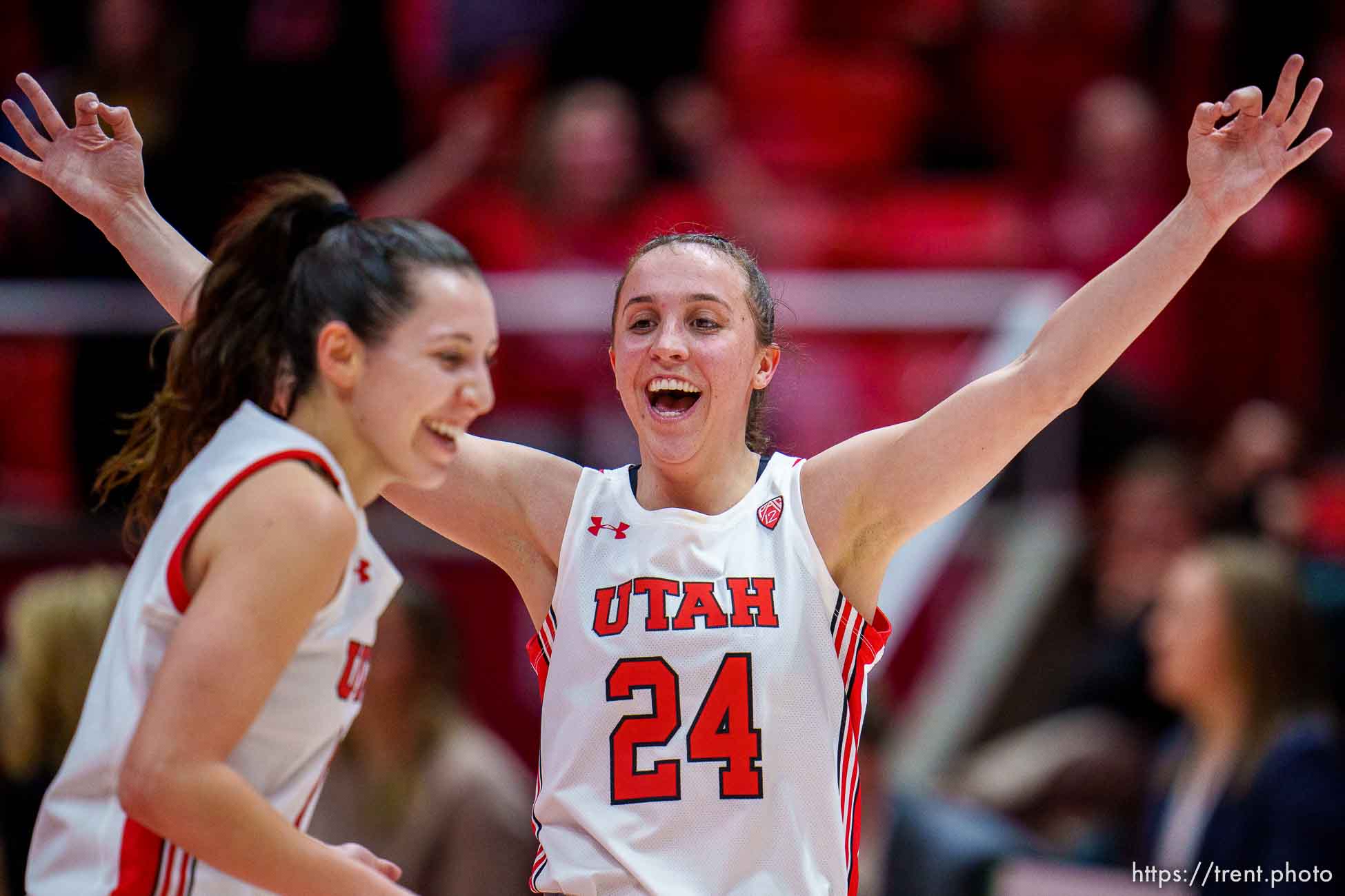 (Trent Nelson  |  The Salt Lake Tribune) Utah Utes guard Issy Palmer (1) and Utah Utes guard Kennady McQueen (24) celebrate Palmer's half court shot to end the first half as Utah hosts Washington, NCAA basketball in Salt Lake City on Friday, Feb. 10, 2023.