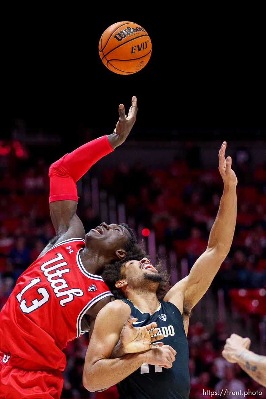 (Trent Nelson  |  The Salt Lake Tribune) Utah Utes center Keba Keita (13) and Colorado Buffaloes guard Javon Ruffin (11) as Utah hosts Colorado, NCAA basketball in Salt Lake City on Saturday, Feb. 11, 2023.