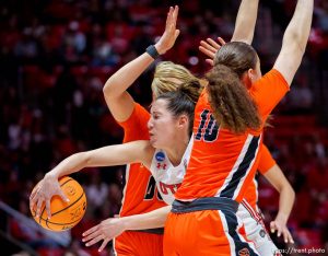 (Trent Nelson  |  The Salt Lake Tribune) Utah Utes guard Issy Palmer (1) passes between two defenders as Utah hosts Princeton, NCAA basketball in Salt Lake City on Sunday, March 19, 2023.