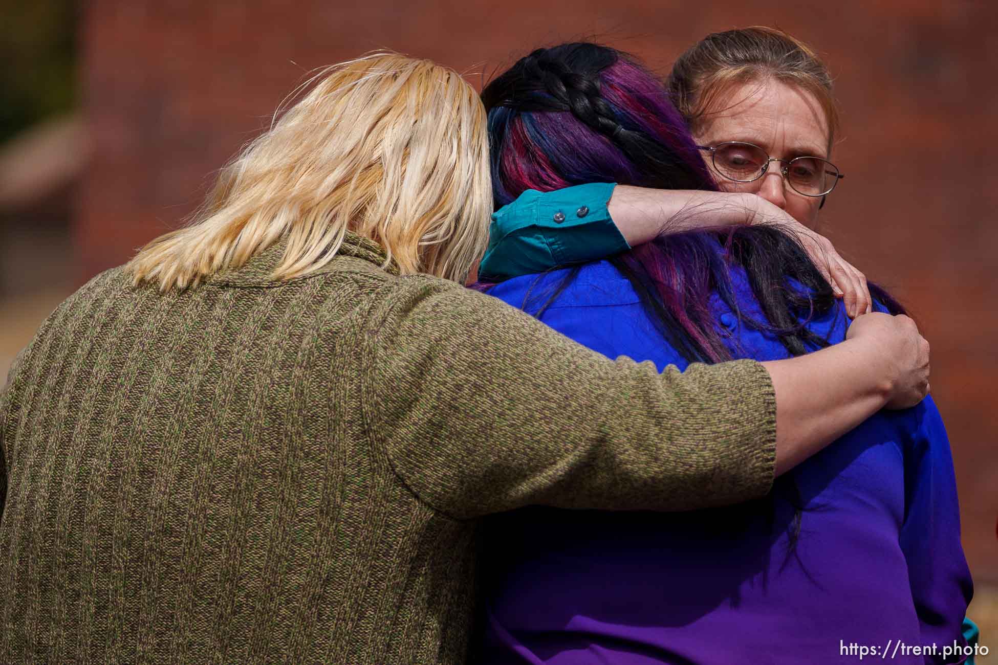 (Trent Nelson  |  The Salt Lake Tribune) Carlie Pipkin and Gladys Wayman embrace Sarah Johnson after she talked about her missing son at a news conference to draw attention to missing FLDS children in Cedar City on Monday, April 17, 2023.