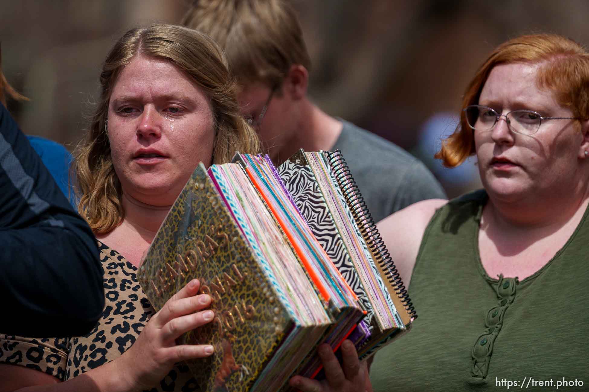 (Trent Nelson  |  The Salt Lake Tribune) Leandra Jessop holds the journals she kept after being taken away from her family, at a news conference to draw attention to missing FLDS children, in Cedar City on Monday, April 17, 2023.