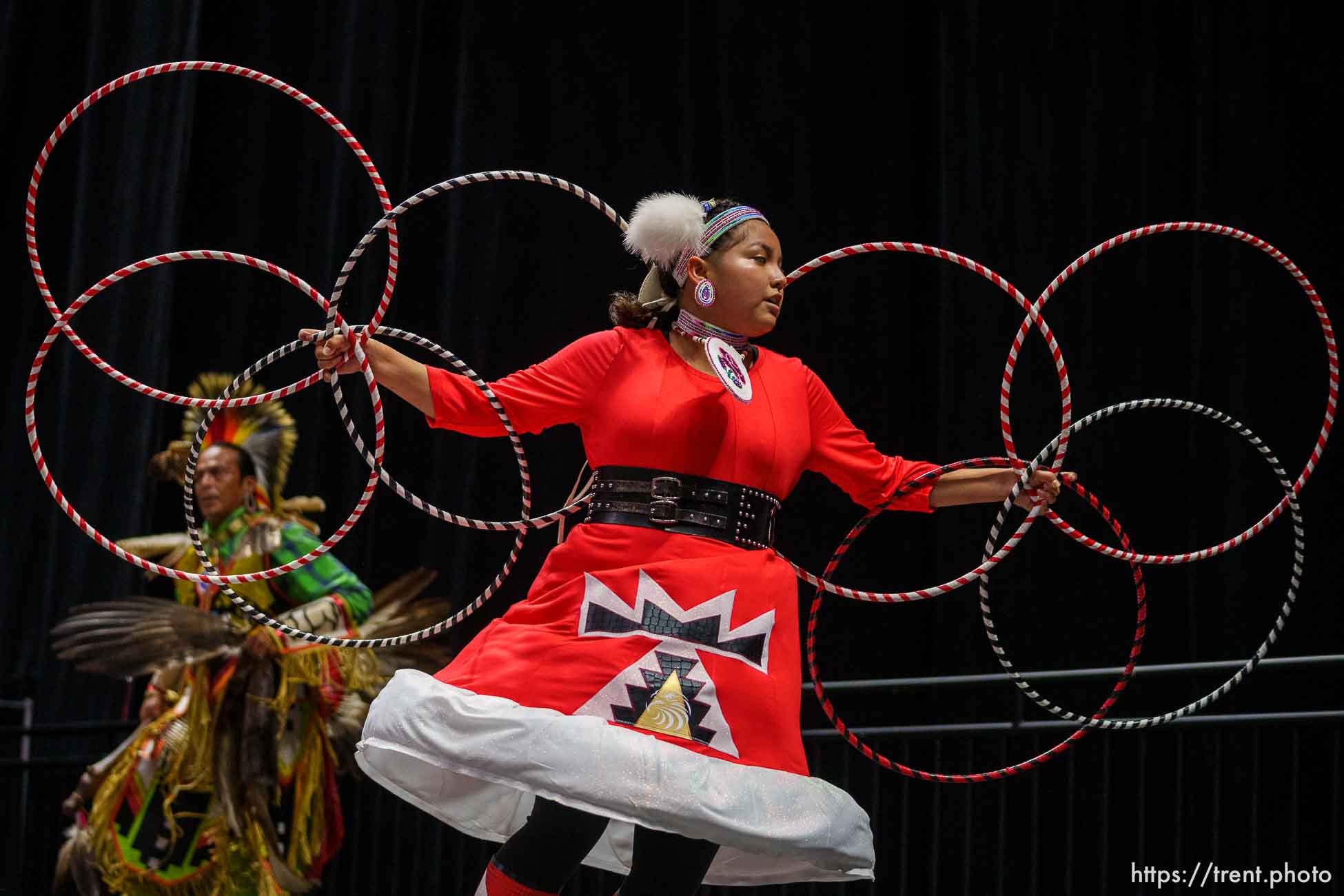 (Trent Nelson  |  The Salt Lake Tribune) Kayden Denny performs a Native American Hoop Dance at Highland High School's graduation in Salt Lake City on Friday, June 9, 2023. At left is Tonka Chee.