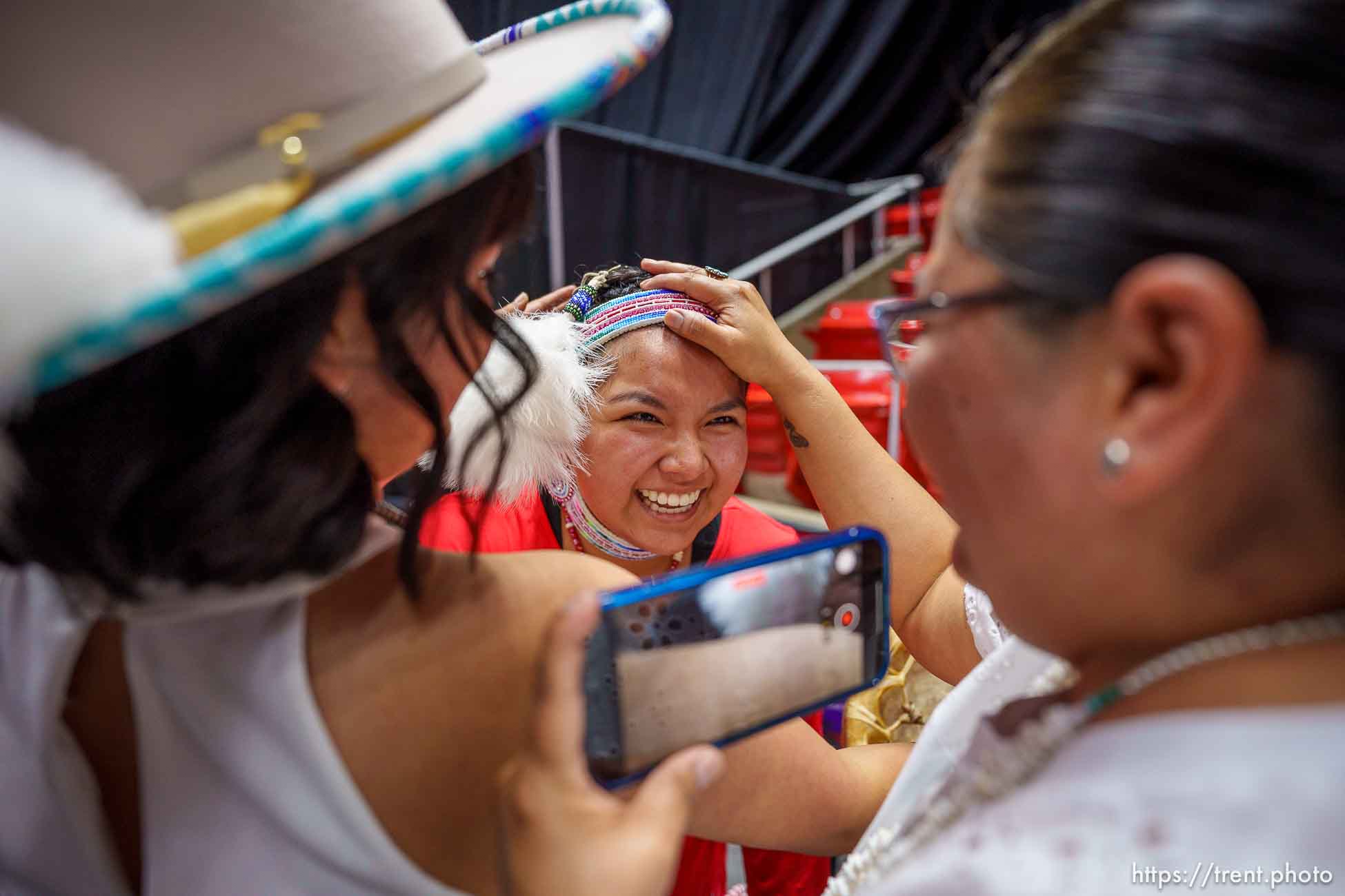(Trent Nelson  |  The Salt Lake Tribune) Kayden Denny with her sister Jace and mother Tanya after performing a Native American Hoop Dance at Highland High School's graduation in Salt Lake City on Friday, June 9, 2023.