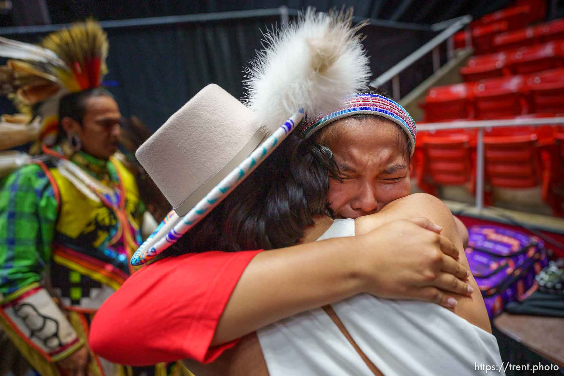 (Trent Nelson  |  The Salt Lake Tribune) Kayden Denny embraces her sister Jace after performing a Native American Hoop Dance at Highland High School's graduation in Salt Lake City on Friday, June 9, 2023.