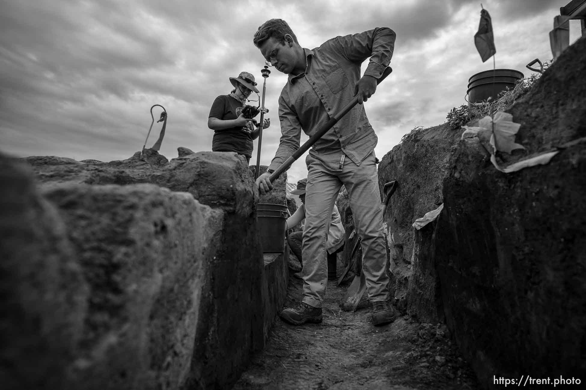 (Trent Nelson  |  The Salt Lake Tribune) Faculty and students from BYU's 2023 Archaeological Field School explore the remains of a 1000-year-old Fremont Indian village at the Hinckley Mounds in west Provo on Wednesday, June 14, 2023. Amber Clayton, Emma Johnson, Mason Lee.