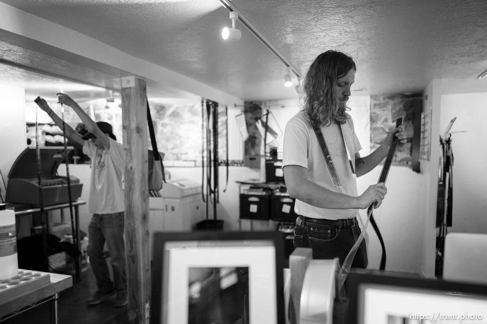 (Trent Nelson  |  The Salt Lake Tribune) Ethan Morgan and Robert Sagers developing film in the lab at Essential Photo Supply in Salt Lake City on Friday, June 2, 2023.