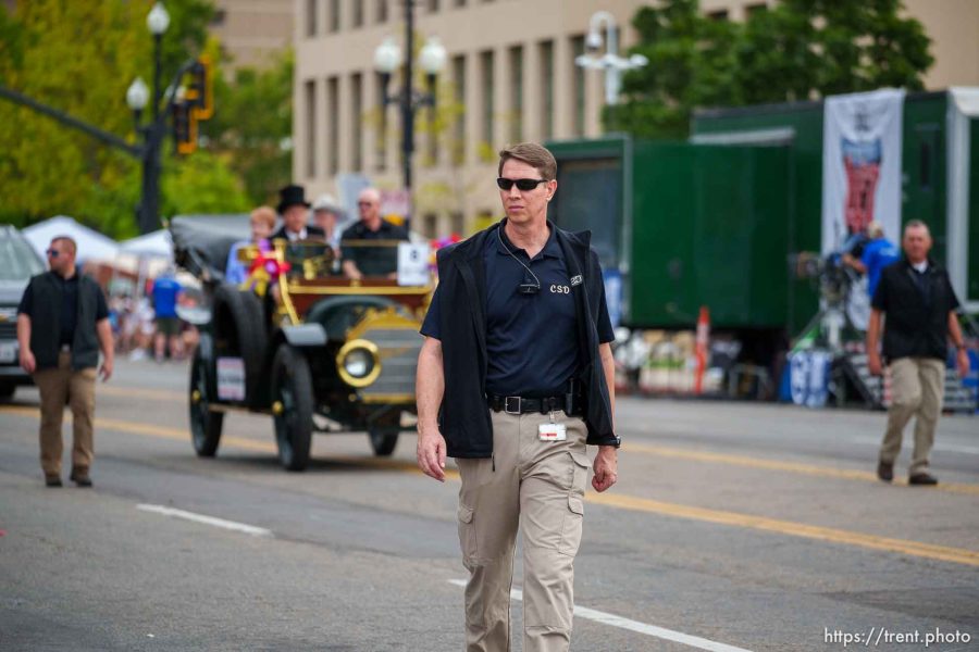 (Trent Nelson  |  The Salt Lake Tribune) LDS security surrounding Elder D. Todd and Kathy Christofferson at the Days of '47 Parade in Salt Lake City on Monday, July 24, 2023.