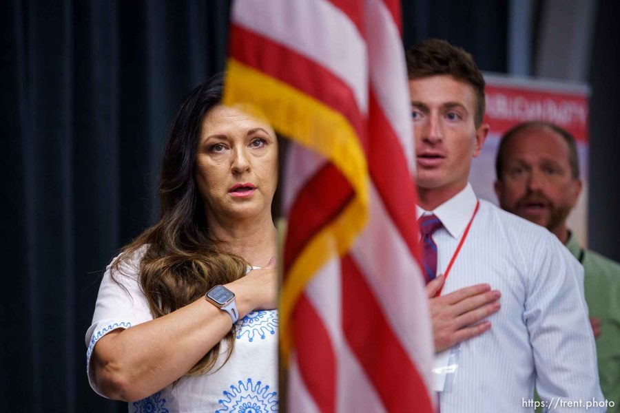 (Trent Nelson  |  The Salt Lake Tribune) Kim Coleman and McKay Newell during the Pledge of Allegiance as the Utah Republican Party holds its quarterly State Central Committee meeting in Sandy on Saturday, Aug. 19, 2023.