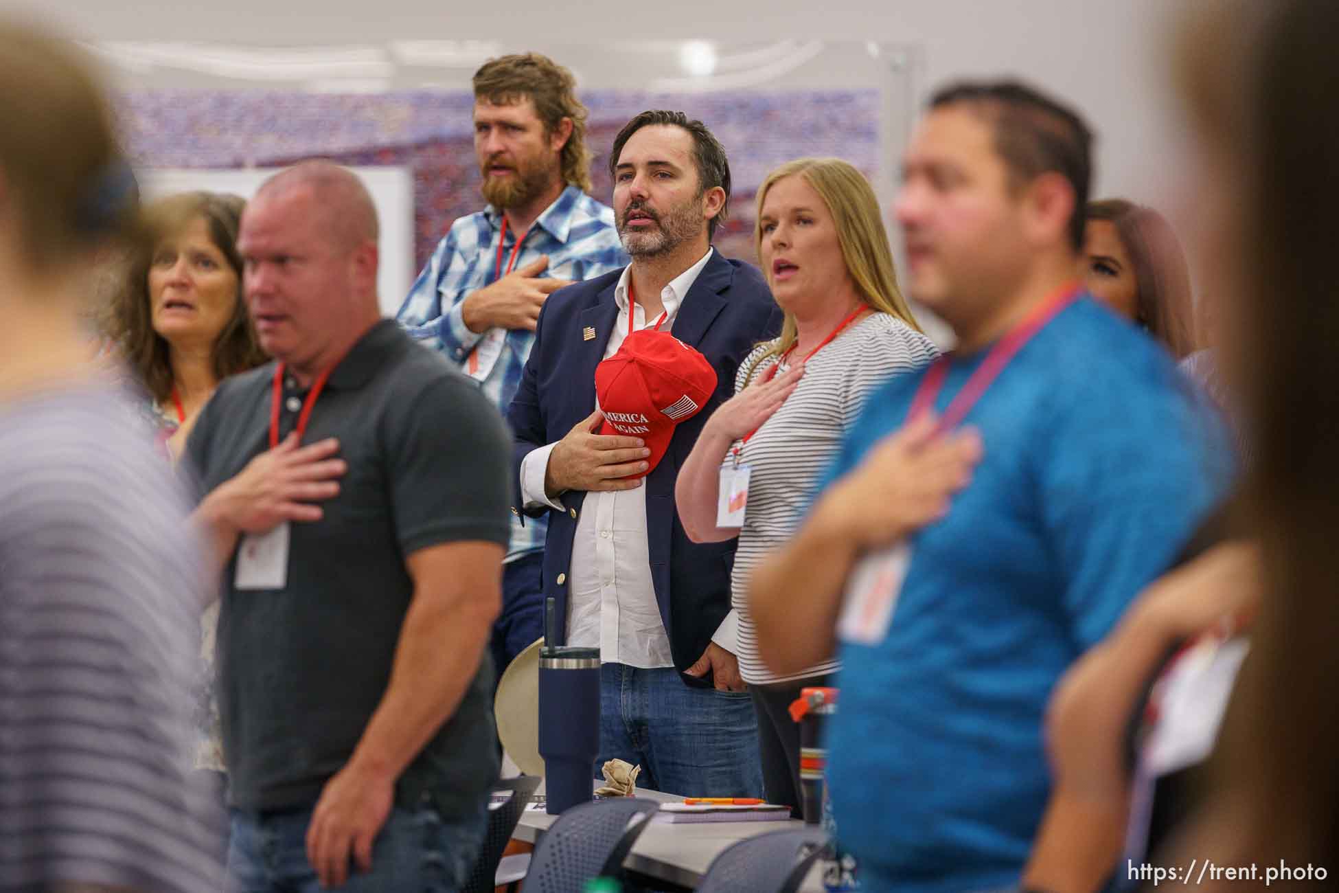 (Trent Nelson  |  The Salt Lake Tribune) The Pledge of Allegiance as the Utah Republican Party holds its quarterly State Central Committee meeting in Sandy on Saturday, Aug. 19, 2023.