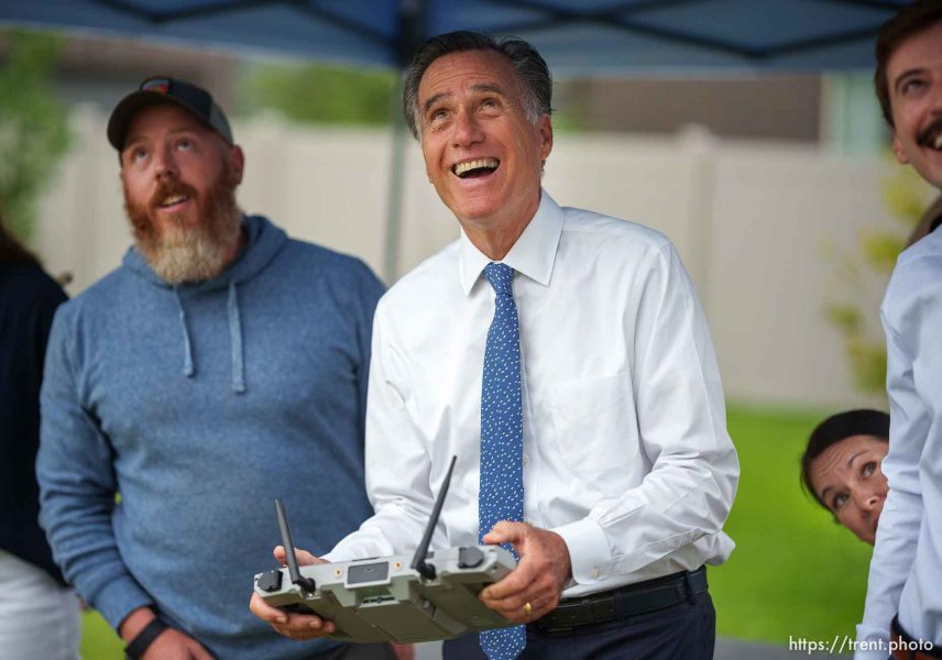(Trent Nelson  |  The Salt Lake Tribune) Utah Sen. Mitt Romney flies a Teal 2 drone during a tour of Teal Drones in Salt Lake City on Tuesday, Aug. 22, 2023. At left is Evan Paul.
