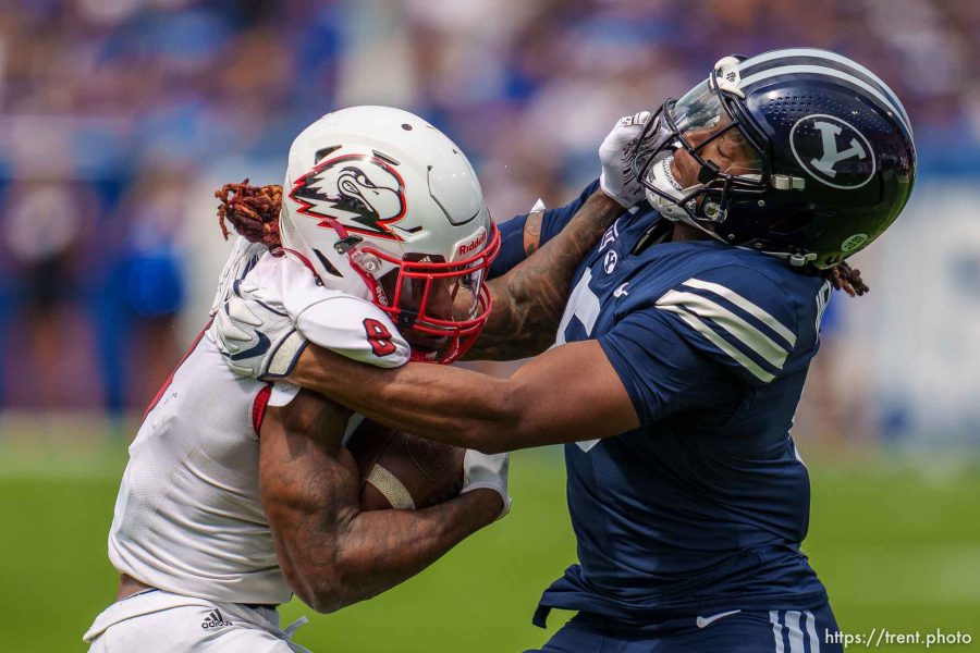 (Trent Nelson  |  The Salt Lake Tribune) Southern Utah Thunderbirds wide receiver Isaiah Wooden (8) is tackled by Brigham Young Cougars cornerback Eddie Heckard (5) as BYU hosts Southern Utah University, NCAA football in Provo on Saturday, Sept. 9, 2023.