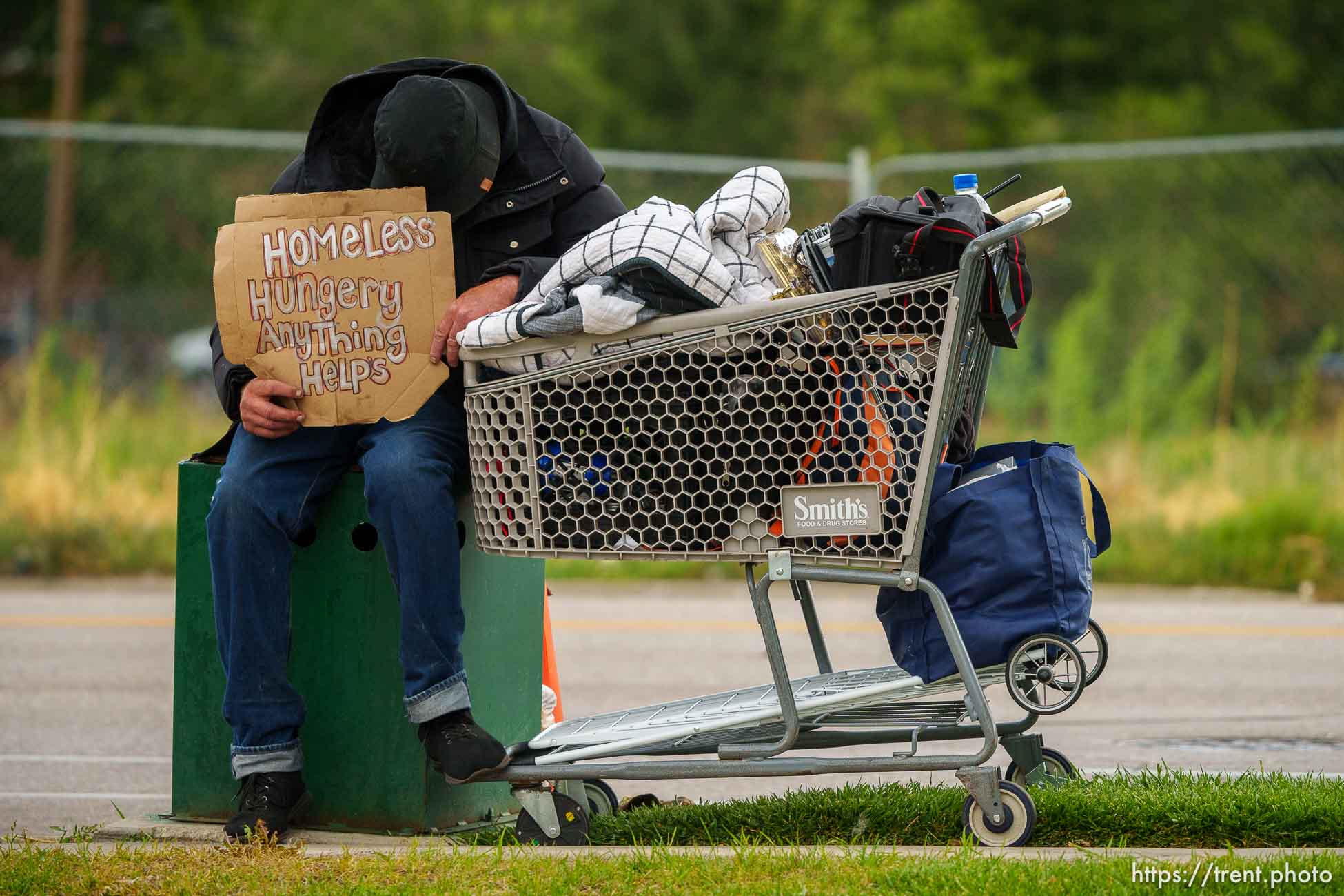 man with sign, redwood road, Thursday September 21, 2023.