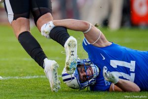 (Trent Nelson  |  The Salt Lake Tribune) Brigham Young Cougars linebacker Harrison Taggart (11) stops Texas Tech Red Raiders quarterback Jake Strong (17) as BYU hosts Texas Tech, NCAA football in Provo on Saturday, Oct. 21, 2023.