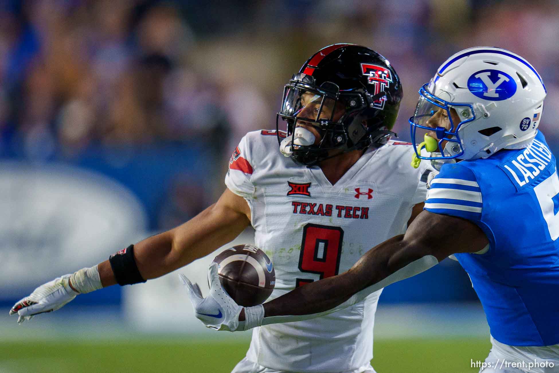 (Trent Nelson  |  The Salt Lake Tribune) Brigham Young Cougars wide receiver Darius Lassiter (5) reaches for the ball as BYU hosts Texas Tech, NCAA football in Provo on Saturday, Oct. 21, 2023. Defending is Texas Tech Red Raiders defensive back C.J. Baskerville (9).