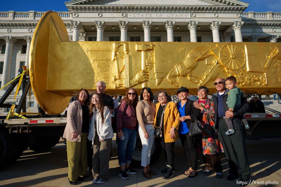 (Trent Nelson  |  The Salt Lake Tribune) Members of the Chinese Railroad Workers Descendants Association and family members pose in front of the Golden Spike Monument on display at the State Capitol in Salt Lake City on Monday, Oct. 23, 2023.