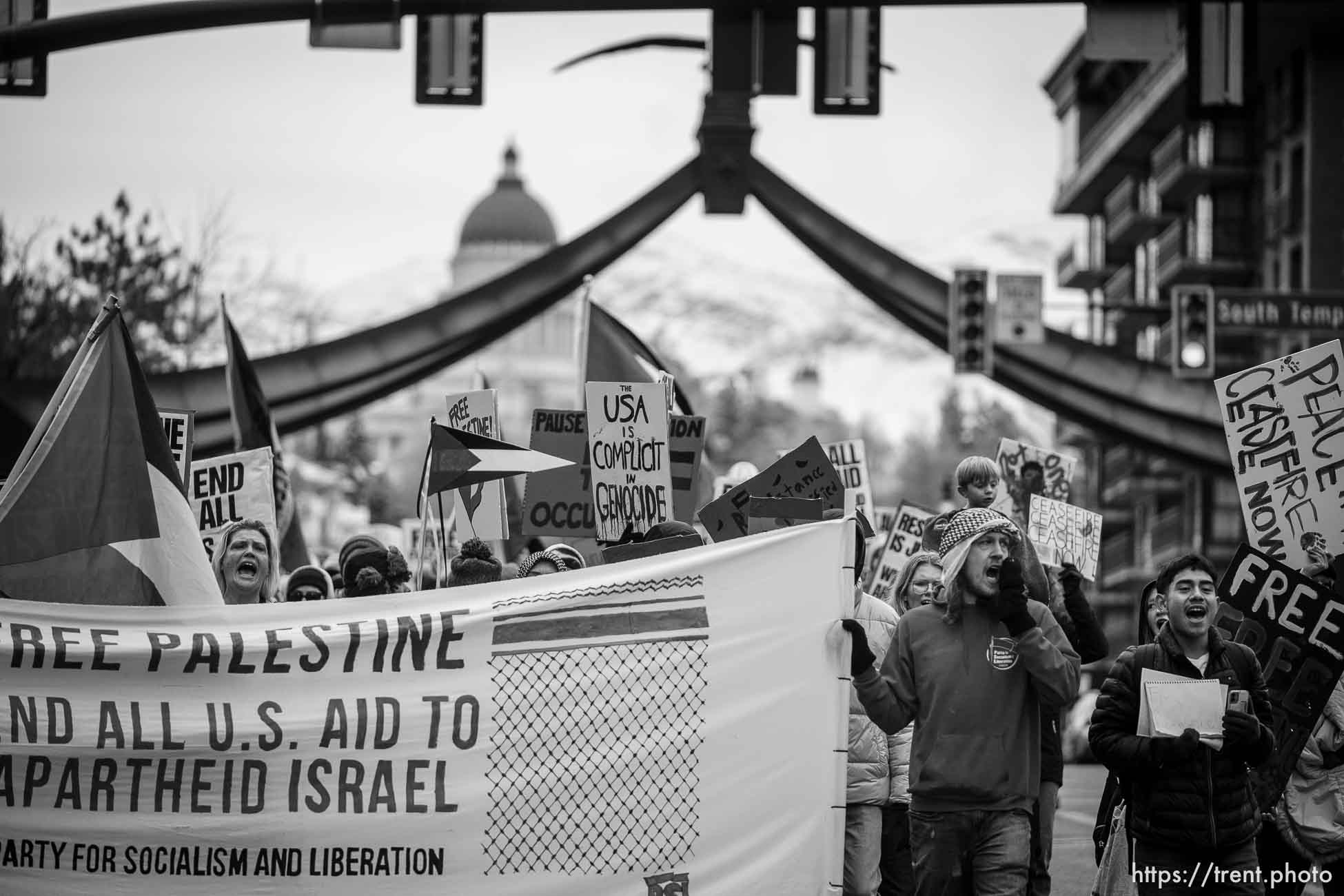 (Trent Nelson  |  The Salt Lake Tribune) People march down State Street in support of Palestine in Salt Lake City on Friday, Nov. 24, 2023.