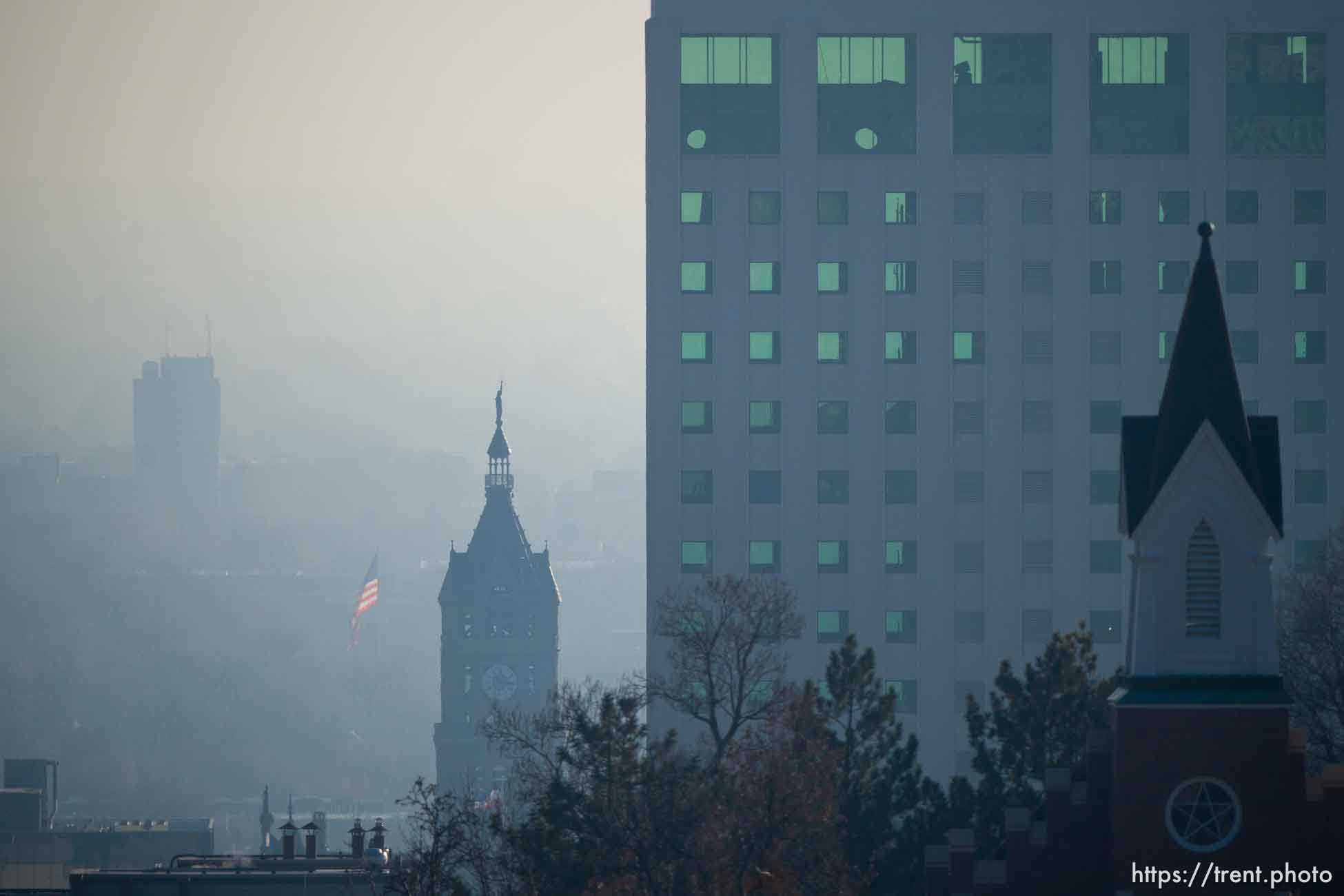 (Trent Nelson | The Salt Lake Tribune) Haze fills the air during an inversion in Salt Lake City on Thursday December 28, 2023.