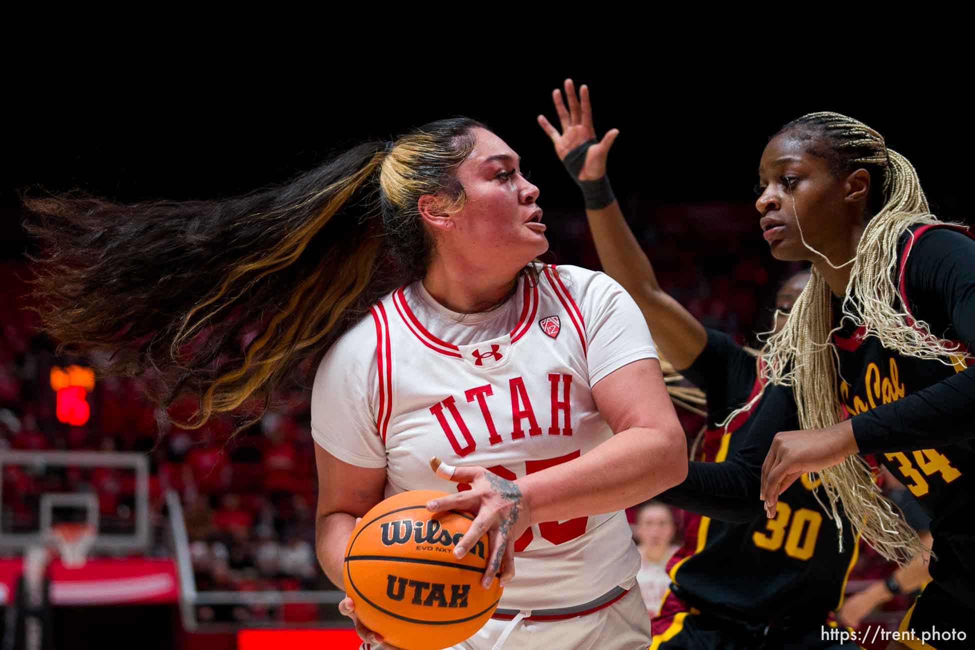 (Trent Nelson  |  The Salt Lake Tribune) Utah Utes forward Alissa Pili (35) defended by USC Trojans center Clarice Akunwafo (34) as Utah hosts USC, NCAA basketball in Salt Lake City on Friday, Jan. 19, 2024.