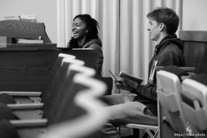 (Trent Nelson  |  The Salt Lake Tribune) Wendy Rivera gets a piano lesson from Elijah Frandsen at the LDS meetinghouse that serves as Pioneer Park Community Resource Center in Provo on Tuesday, Feb. 6, 2024.