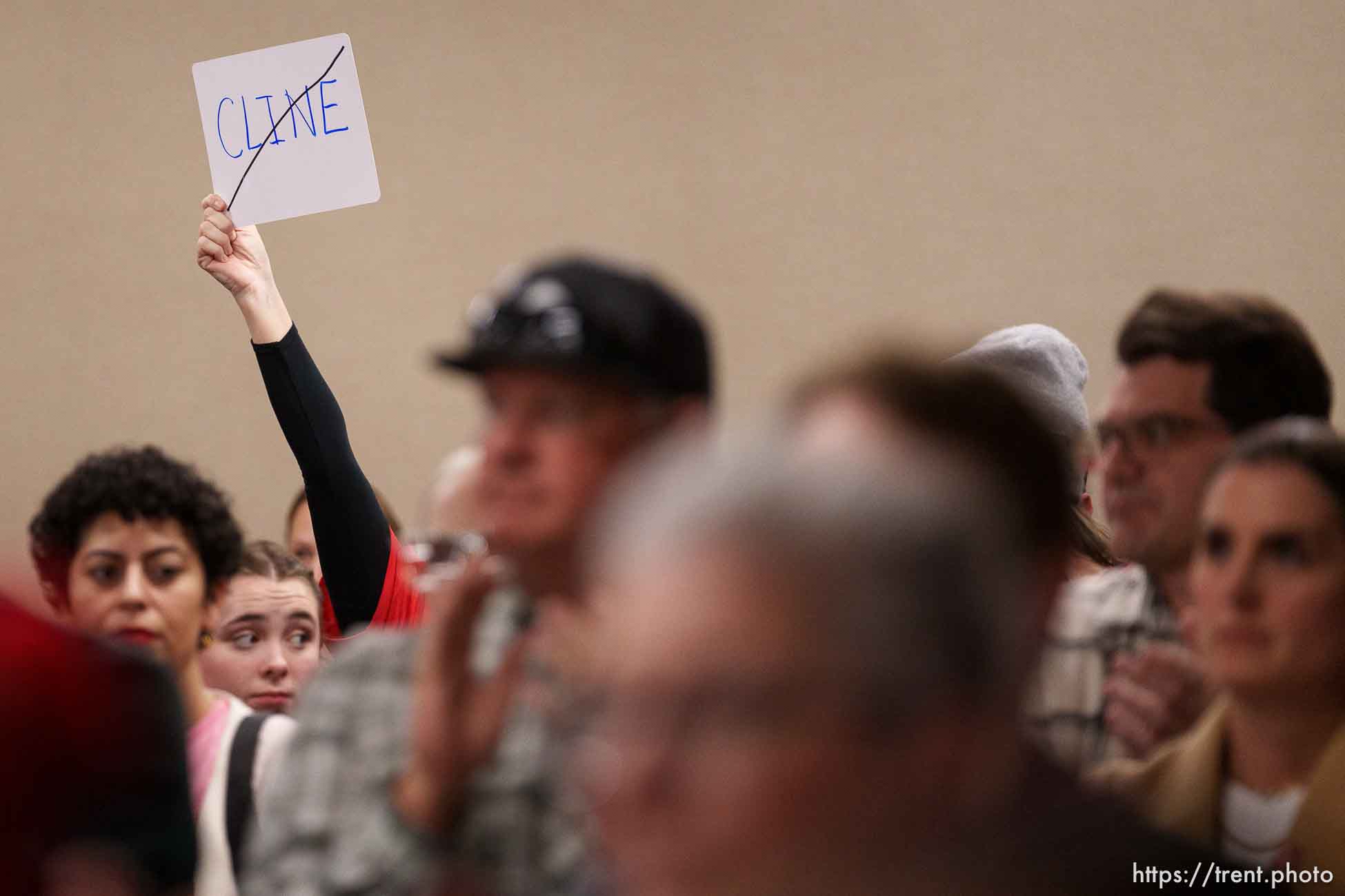 (Trent Nelson  |  The Salt Lake Tribune) An attendee holds a sign after the Granite School District's board passed a resolution against the actions of Natalie Cline and in support of its student athlete during a meeting in South Salt Lake on Friday, Feb. 9, 2024.