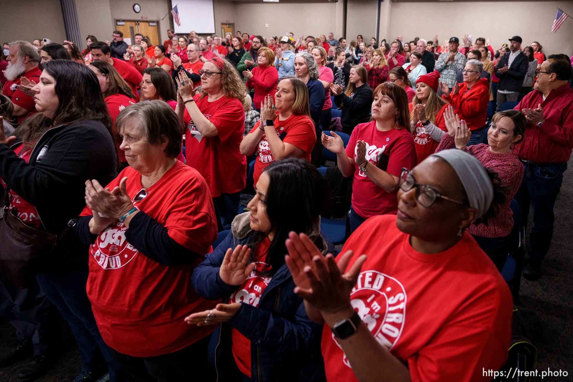 (Trent Nelson  |  The Salt Lake Tribune) Attendees stand and applaud after the Granite School District's board passed a resolution against the actions of Natalie Cline and in support of its student athlete during a meeting in South Salt Lake on Friday, Feb. 9, 2024.