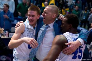 (Trent Nelson  |  The Salt Lake Tribune) Brigham Young Cougars forward Noah Waterman (0), Mark Pope, and Brigham Young Cougars forward Fousseyni Traore (45) celebrate the win as BYU hosts Baylor, NCAA basketball in Provo on Tuesday, Feb. 20, 2024.