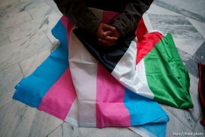 (Trent Nelson  |  The Salt Lake Tribune) Activists in support of transgender rights hold a sit-in in front of a bathroom at the Utah Capitol in Salt Lake City on Thursday, Feb. 22, 2024.