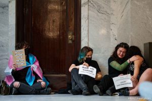 (Trent Nelson  |  The Salt Lake Tribune) Activists in support of transgender rights hold a sit-in in front of a bathroom at the Utah Capitol in Salt Lake City on Thursday, Feb. 22, 2024.