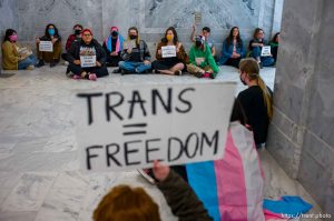 (Trent Nelson  |  The Salt Lake Tribune) Activists in support of transgender rights hold a sit-in in front of a bathroom at the Utah Capitol in Salt Lake City on Thursday, Feb. 22, 2024.