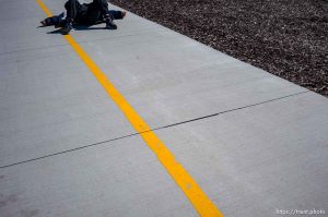 man asleep on bike lane, on Sunday, March 17, 2024.