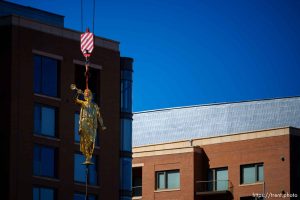 (Trent Nelson  |  The Salt Lake Tribune) The statue of Moroni is returned to the top of the LDS temple in Salt Lake City on Tuesday, April 2, 2024.