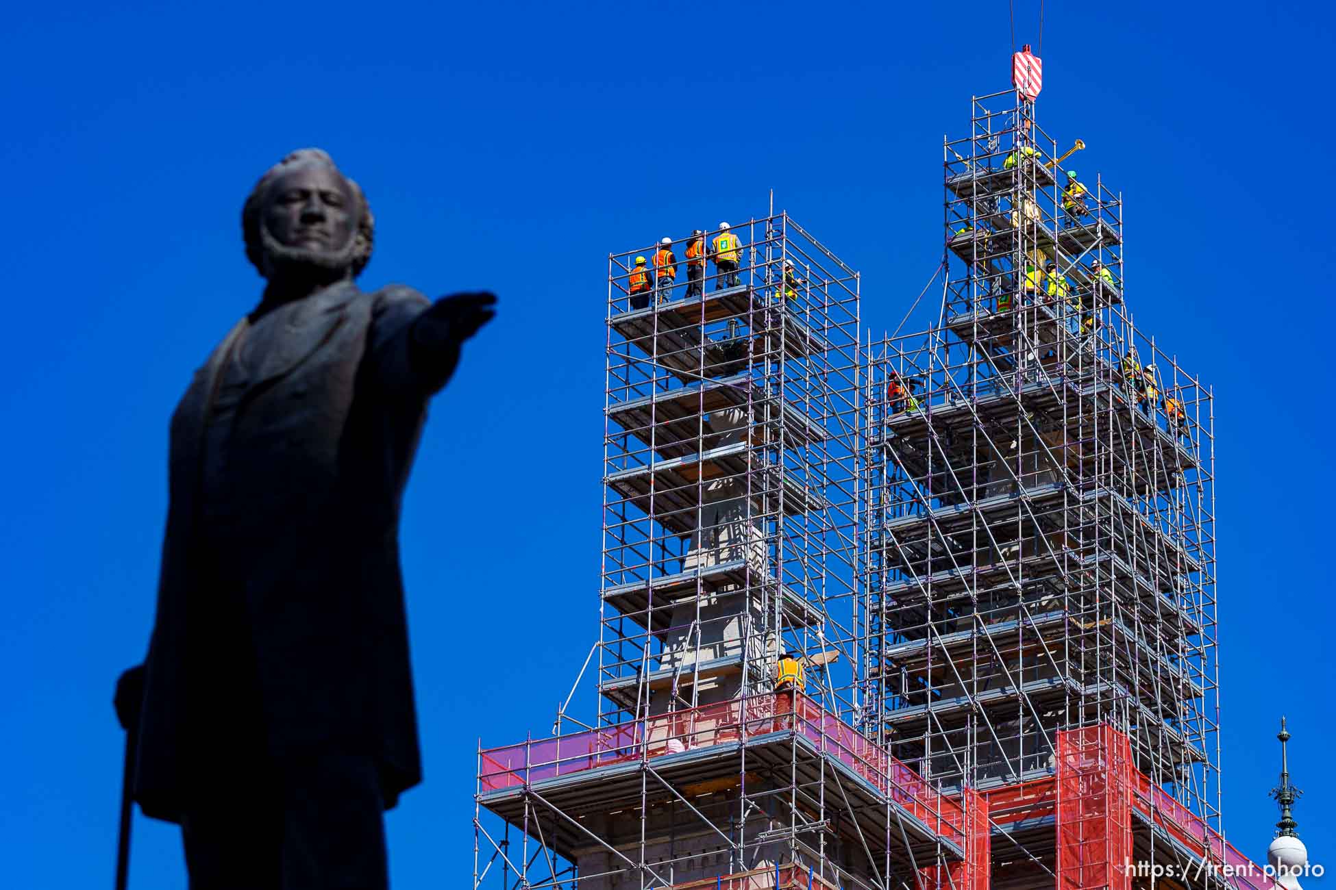 (Trent Nelson  |  The Salt Lake Tribune) The statue of Moroni is returned to the top of the LDS temple in Salt Lake City on Tuesday, April 2, 2024.