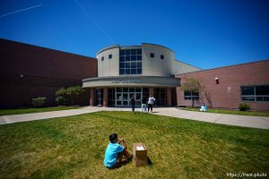 (Trent Nelson  |  The Salt Lake Tribune) A student waits to be picked up on the last day of school at Riley Elementary School in Salt Lake City on Thursday, May 30, 2024.