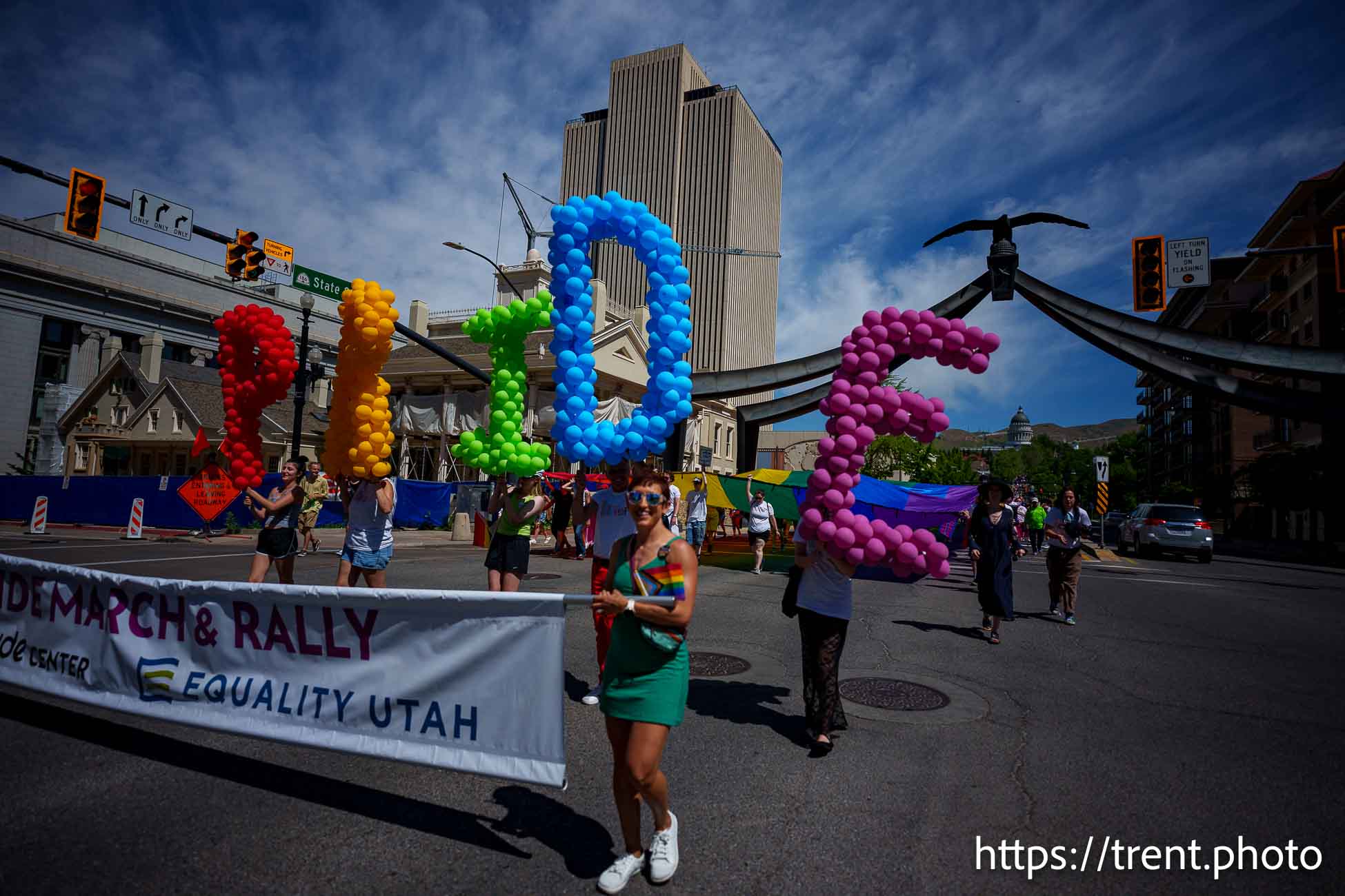 (Trent Nelson  |  The Salt Lake Tribune) People march down State Street in Salt Lake City to kick off the Utah Pride Festival on Saturday, June 1, 2024.