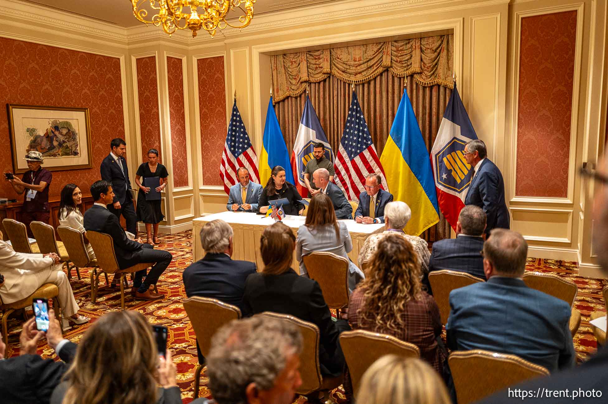 (Trent Nelson  |  The Salt Lake Tribune) Gov. Spencer Cox and Ukranian Ambassador to the U.S. Oksana Markarova sign a Memorandum of Understanding between Utah and Kyiv Oblast at the National Governors Association’s summer meeting in Salt Lake City on Friday, July 12, 2024. At rear is  Ukrainian President Volodymyr Zelenskyy. From left are House Speaker Mike Schultz, R-Hooper, Markarova, Zelenskyy, Cox and Senate President Stuart Adams, R-Layton.