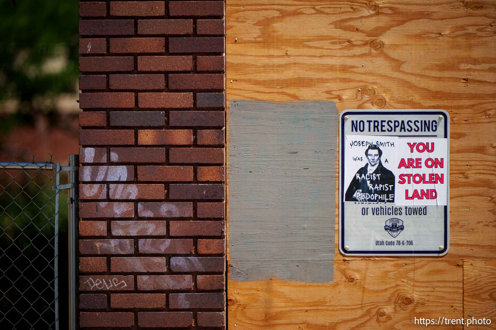 Sign: Joseph Smith was a racist rapist pedophile. You are on stolen land. State Street, Salt Lake City on Thursday, July 25, 2024.