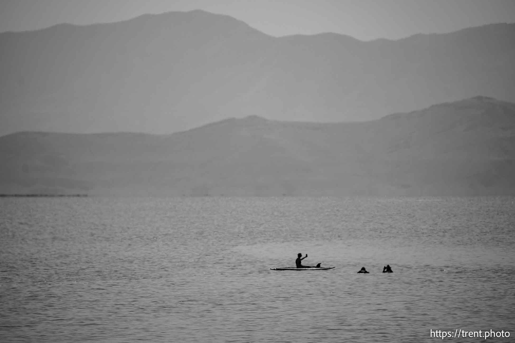 (Trent Nelson  |  The Salt Lake Tribune) People paddleboarding on the Great Salt Lake off Stansbury Island on a smoky Saturday, July 27, 2024.