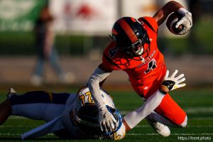 (Trent Nelson  |  The Salt Lake Tribune) Kobe Allen stops Evan Talbot as Murray hosts Taylorsville, high school football  on Friday, Aug. 23, 2024.