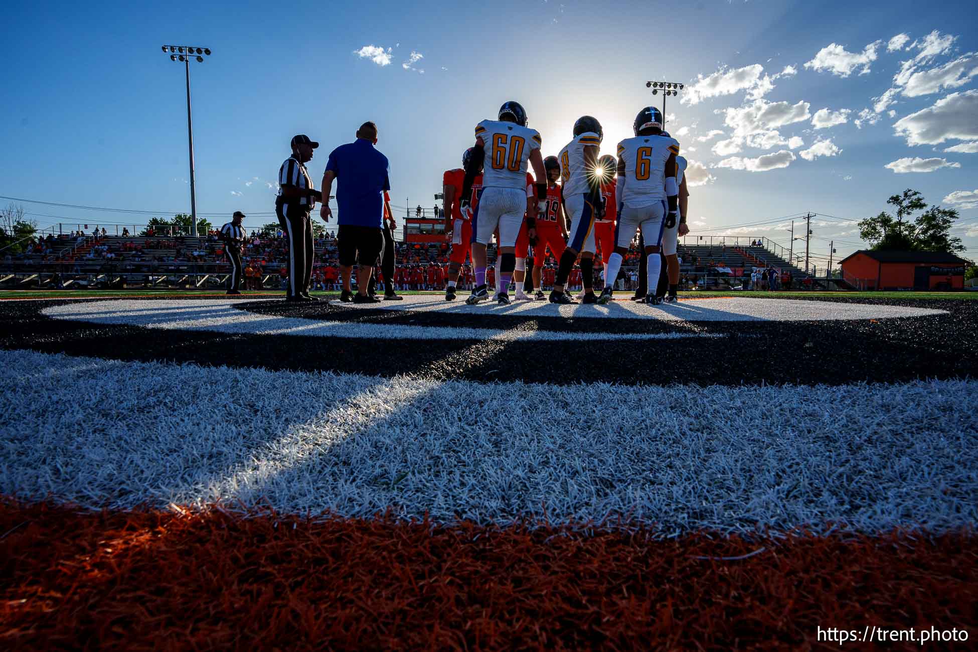 (Trent Nelson  |  The Salt Lake Tribune) Players meet for the coin toss as Murray hosts Taylorsville, high school football  on Friday, Aug. 23, 2024.