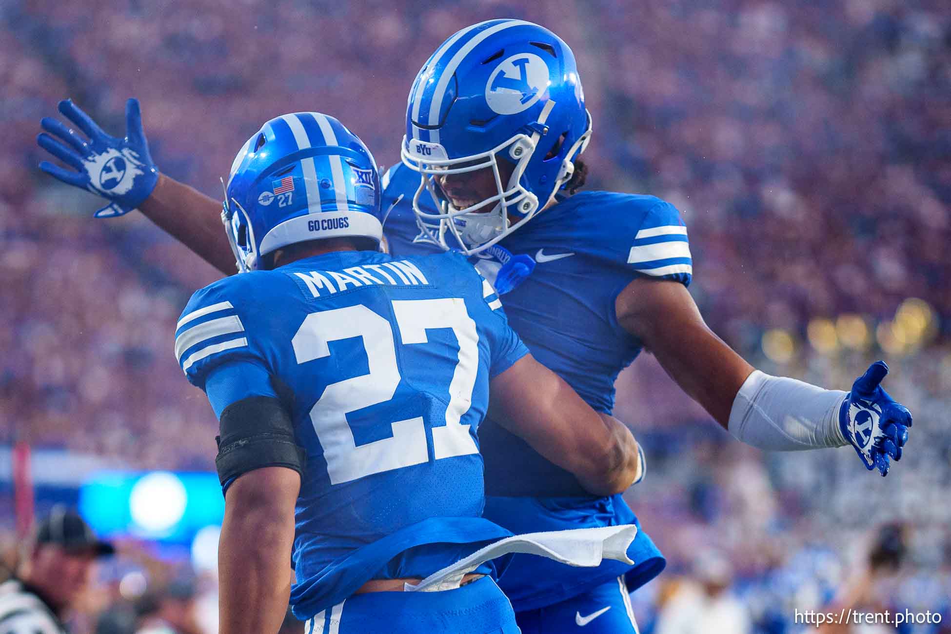 (Trent Nelson  |  The Salt Lake Tribune) Brigham Young Cougars running back LJ Martin (27) and Brigham Young Cougars tight end Keanu Hill (1) celebrate a touchdown as BYU hosts Southern Illinois, NCAA football in Provo on Saturday, Aug. 31, 2024.