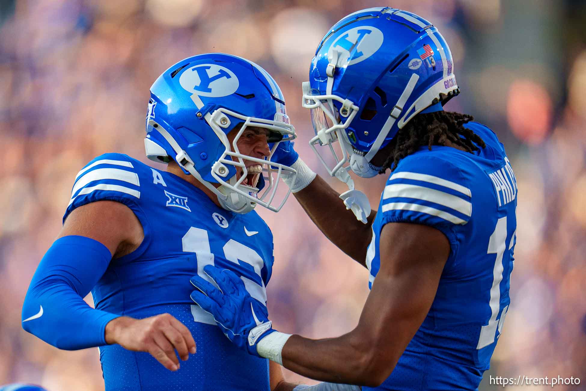 (Trent Nelson  |  The Salt Lake Tribune) Brigham Young Cougars quarterback Jake Retzlaff (12) and Brigham Young Cougars wide receiver Jojo Phillips (13) celebrate a touchdown as BYU hosts Southern Illinois, NCAA football in Provo on Saturday, Aug. 31, 2024.