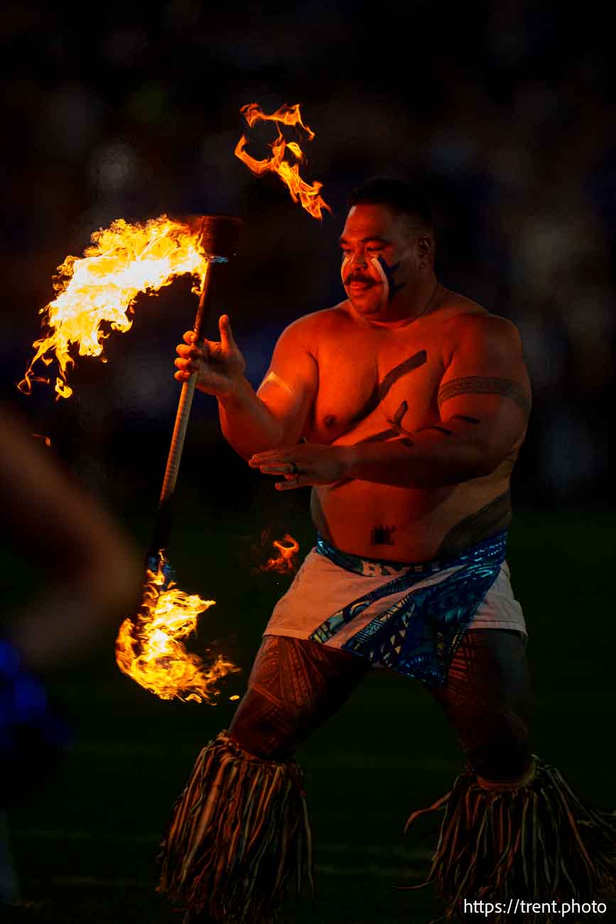 (Trent Nelson  |  The Salt Lake Tribune) Fire dancer as BYU hosts Southern Illinois, NCAA football in Provo on Saturday, Aug. 31, 2024.