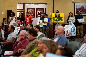 (Trent Nelson  |  The Salt Lake Tribune) People listen to comment before the West Valley City Council's final vote on the proposed rezoning of the land where the Redwood Drive-In and Swap Meet is located, on Tuesday, Sept. 17, 2024.