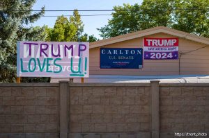 Donald Trump signs in Orem on Monday, Sept. 30, 2024.