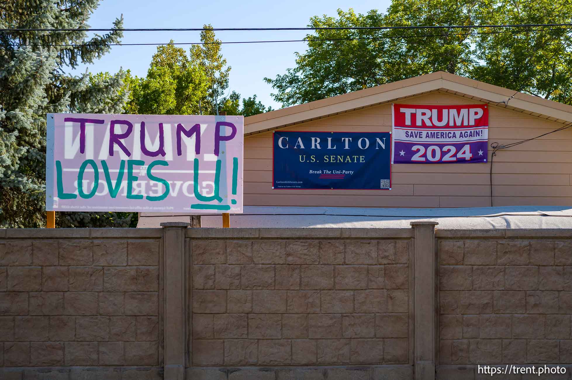 Donald Trump signs in Orem on Monday, Sept. 30, 2024.