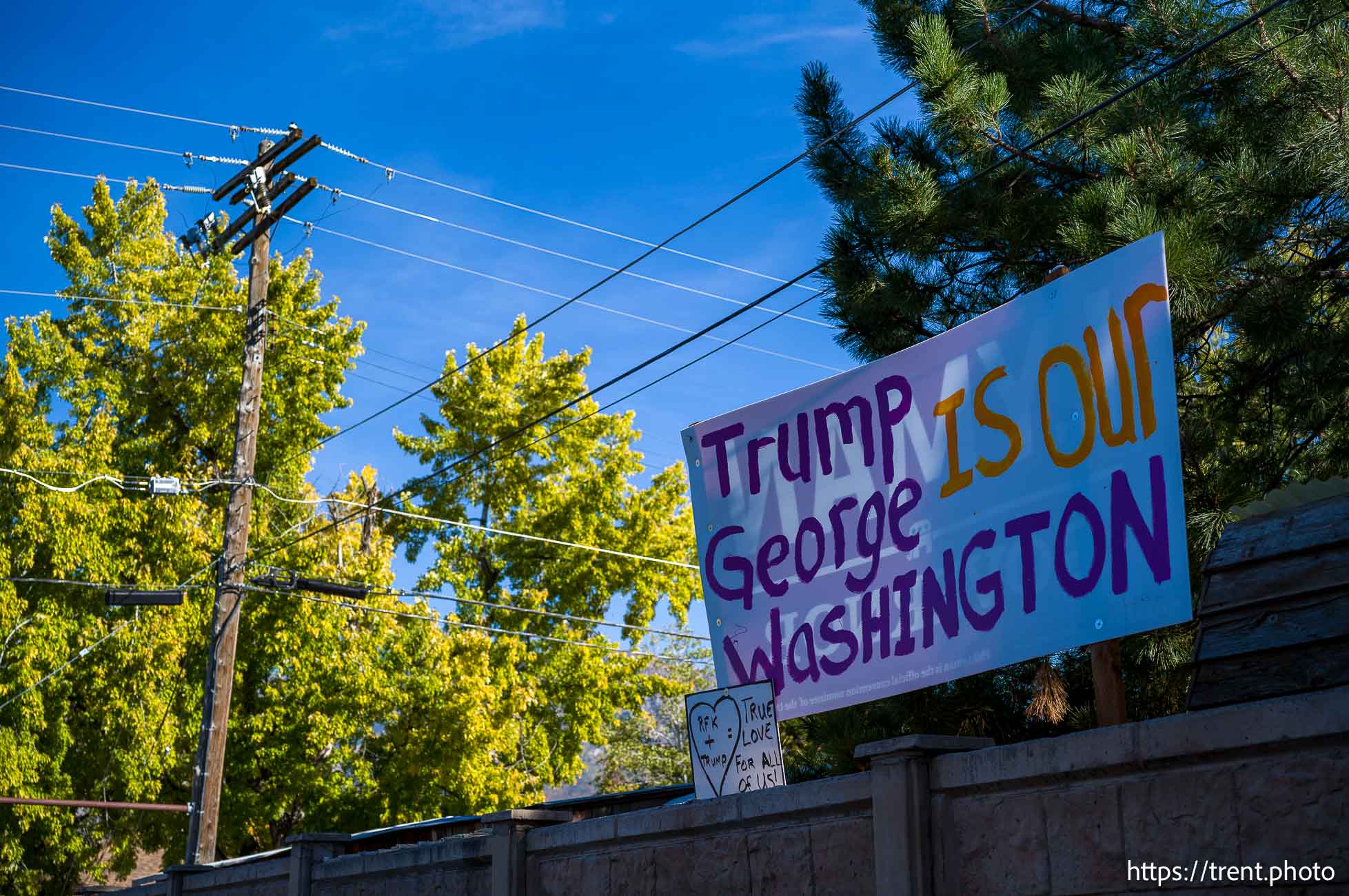 Donald Trump signs in Orem on Monday, Sept. 30, 2024.