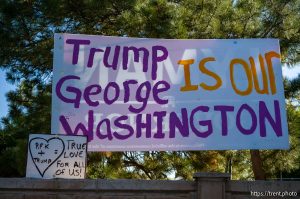 Donald Trump signs in Orem on Monday, Sept. 30, 2024.